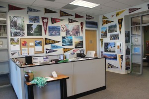 The College Counseling office is decorated with flags and posters from colleges around the world.