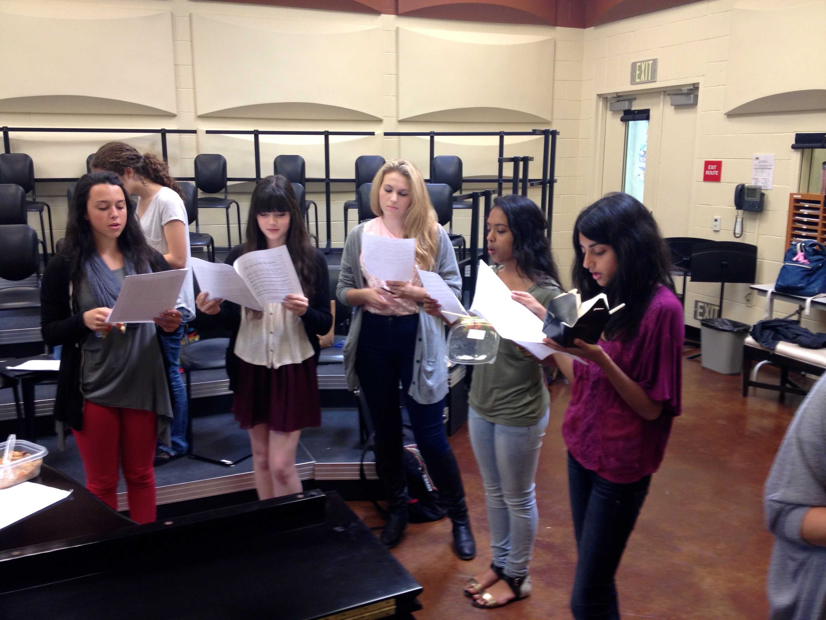 Sage Hill Singers junior Natalie Lowenstein, sophomore Claire Dwyer, senior Sydney Endicott, senior Lauren Anderson, junior Rachana Pillai and senior Kimaya Gokhale rehearse during lunch. September 30 2013. Photographer: Maddi Bukaty