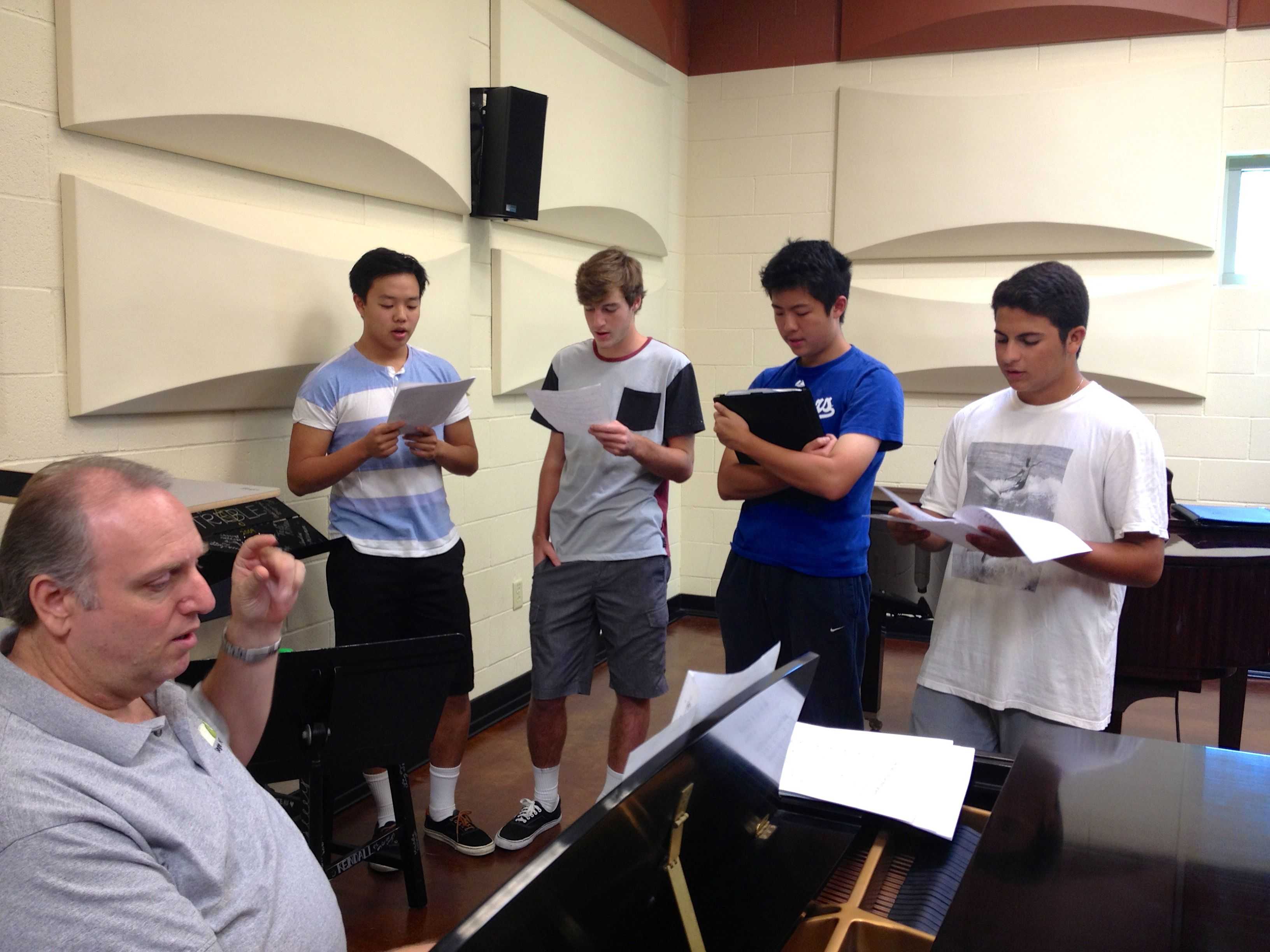 Sage Hill Singers seniors Eric Zheng and Samuel Masarik, sophomore Yilan Dai and junior Amir Soleimany rehearse during lunch. September 30 2013. Photographer: Maddi Bukaty