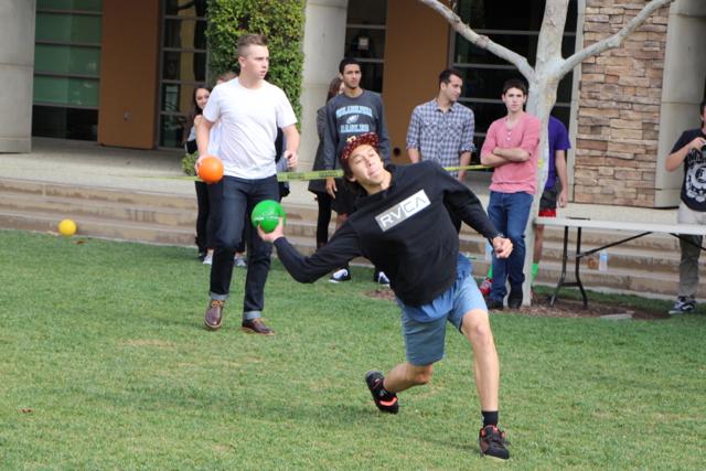 David Swerdlow winds up to throw a dodgeball at the sophomore team.