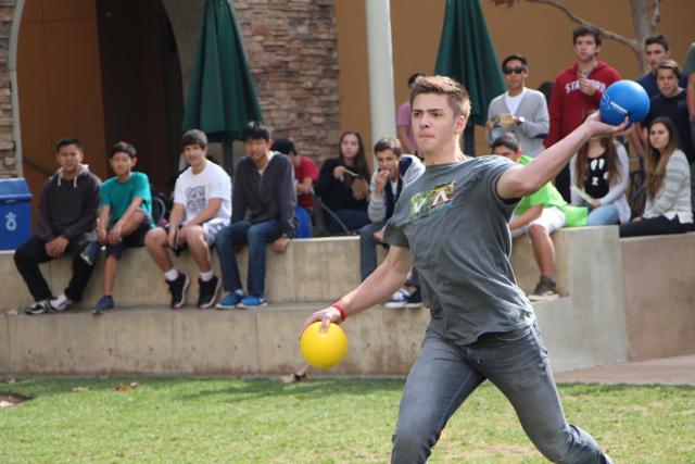Connor Bock fights for survival as the last man standing in the Seniors vs. Sophomores dodgeball game.