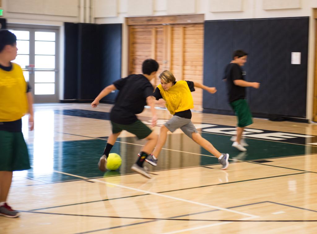 Sage Fit students play indoor soccer inside the Peter V. Ueberroth Gymnasium. October 11, 2013. Photographer: Kellen Ochi