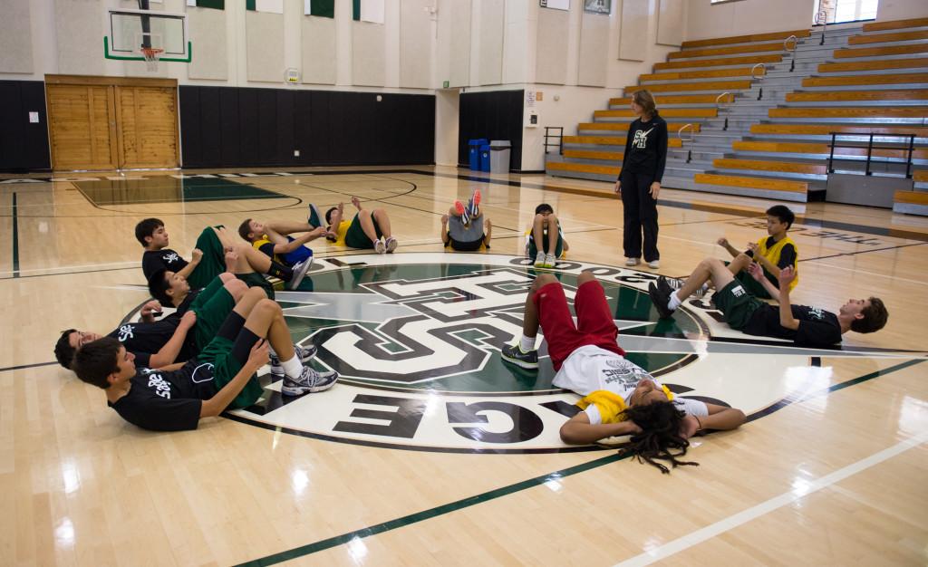 Sage Fit students circle around and do sit-ups in the Peter Ueberroth Gym Friday October 11, 2013. Photographer: Kellen Ochi