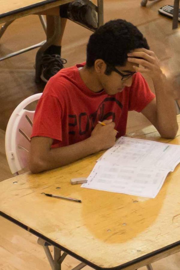 A student takes the PSAT in the Peter V. Ueberroth Gymnasium Oct. 15.