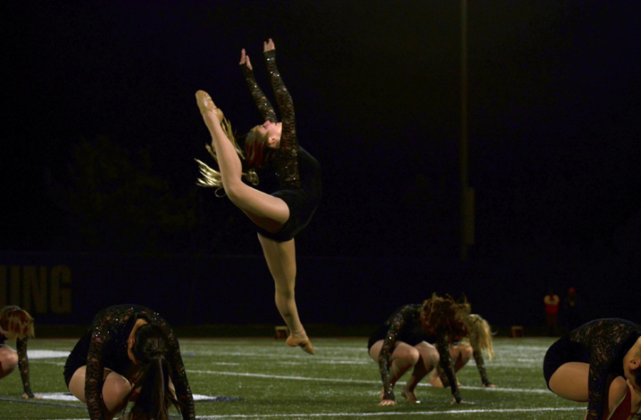 Lauren+Hausman+-+Sophomore%2C+Madeline+Sharp%2C+leaps+into+the+air+during+the+Dance+Team+performance.+Sage+Hills+Dance+Team+preformed+at+the+halftime+show+during+the+homecoming+football+game+on+November+6th%2C+2015.