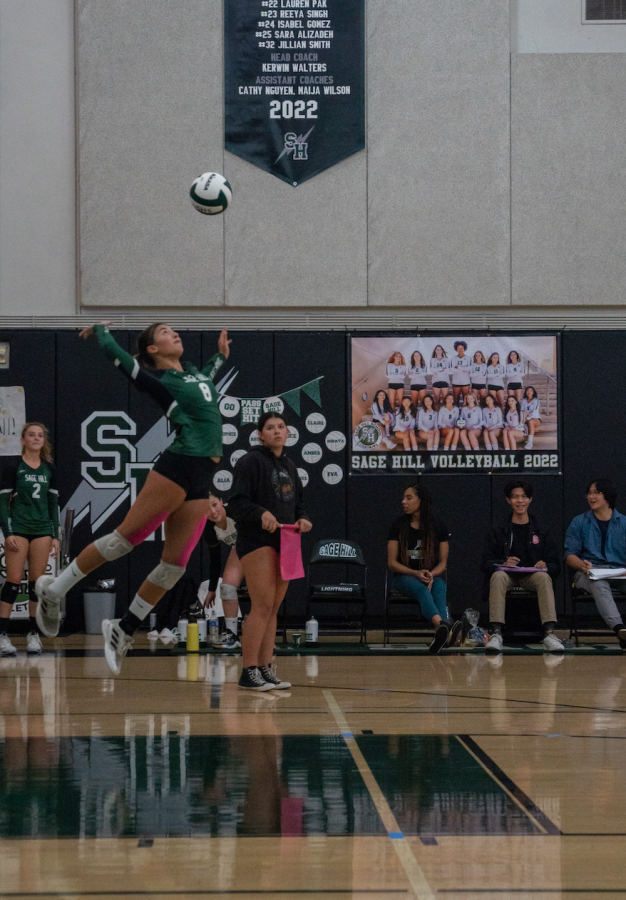 Senior Captains Brooke Thomassen (#8) and Sophie Wang (#7) show off their incredible high jumps during Girls Varsity Volleyballs Senior Night.