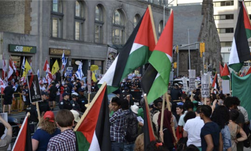 Counterprotests+for+opposing+sides+of+the+Israeli-Palestinian+conflict+square+off+on+a+street+in+Toronto%2C+Ontario.