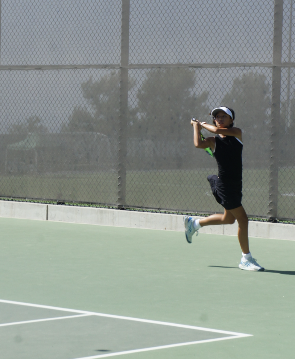 Freshman Alison Wang playing a tennis match against Los Alamitos on August 29, 2024