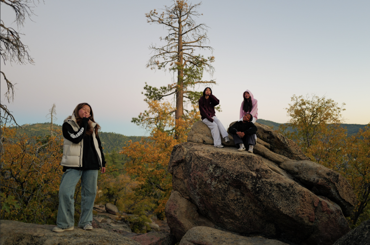 Freshmen Ruby Wang, Sophia Lin, Jaden Rall, and Gabby Park during free time at Cedar Lake Camp on Oct. 23.