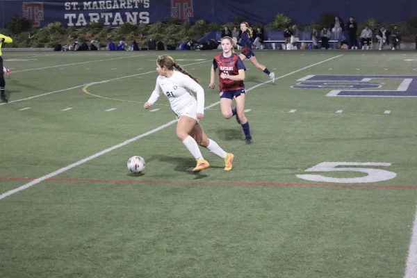 Freshman Gisselle Barron drives the ball against St. Margaret’s on Jan. 24.