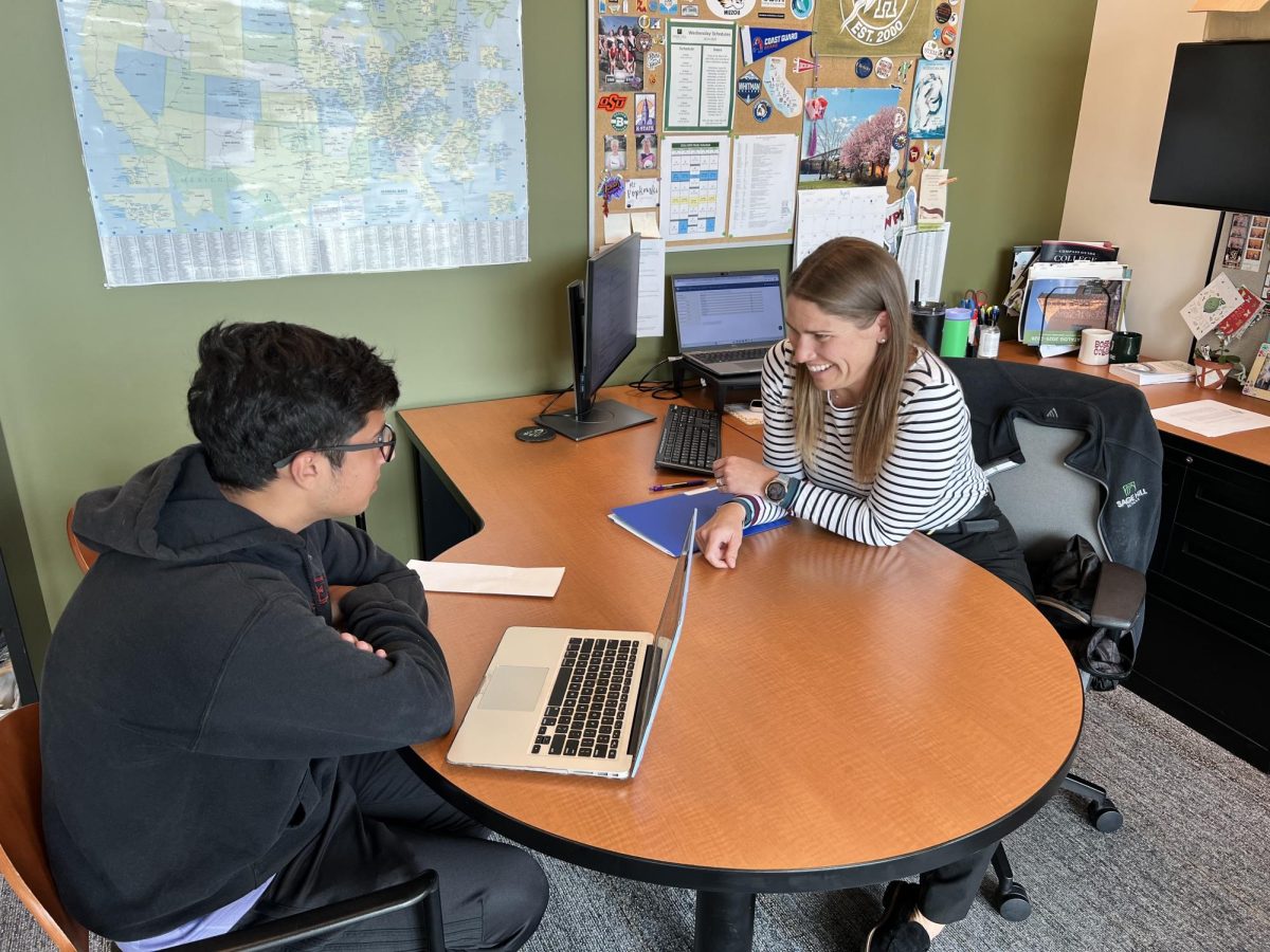 Senior Noah Jimenez chats with Associate Director of College Counseling Lauren Popkowski.