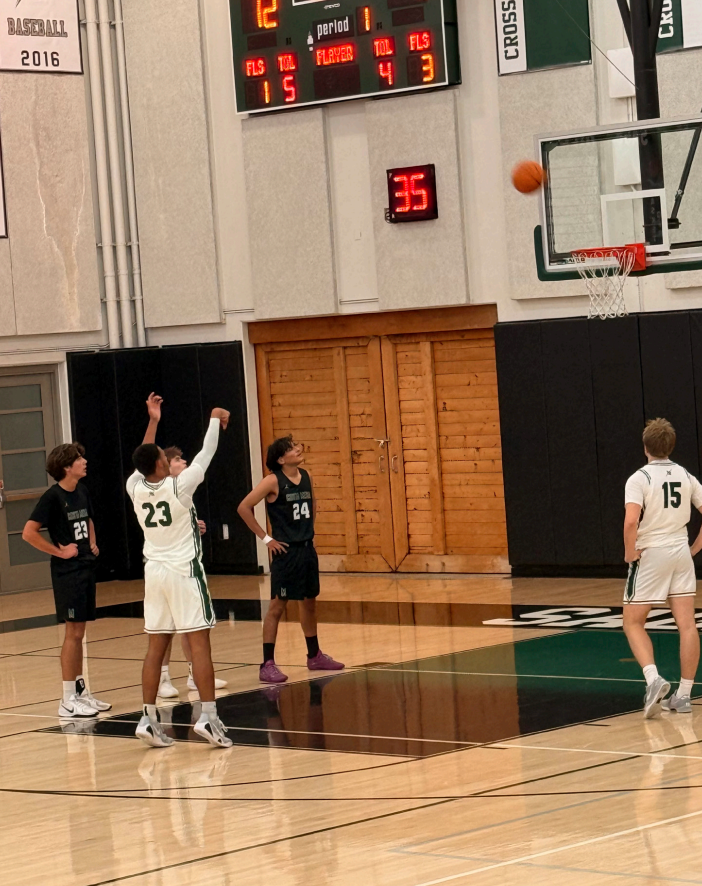 Junior Trey Cradle takes a free throw during the team’s win, helping seal the victory from the line. 