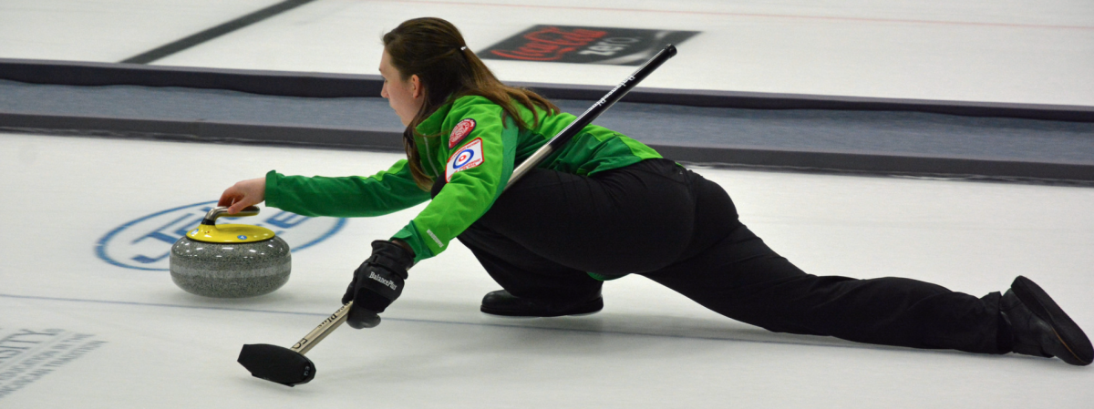 A woman prepares to deliver a stone.