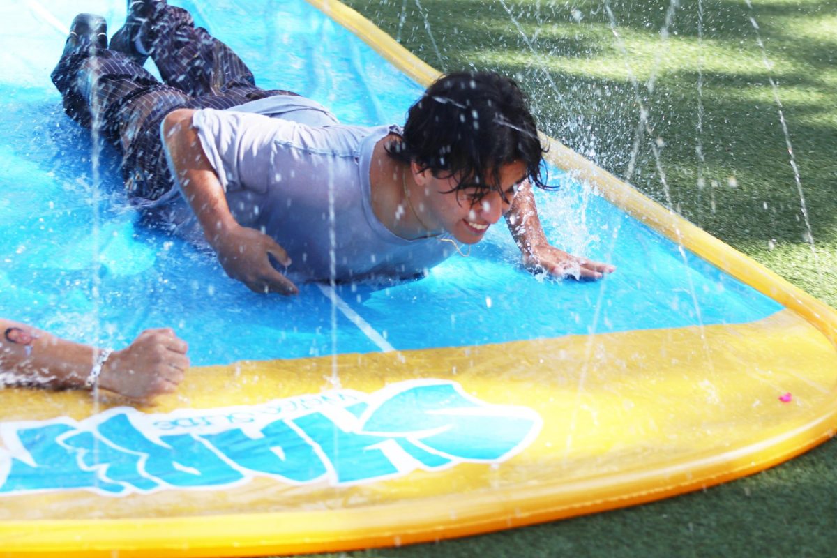 Sophomore Sam Gabriel races on the slip-and-slide.
